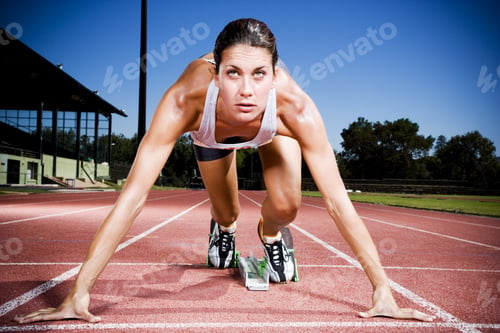 Preview: Portrait Of Female Athlete In The Starting Blocks
