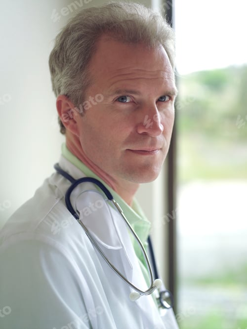 Preview: Portrait Of Doctor In White Coat With Stethoscope In Hospital