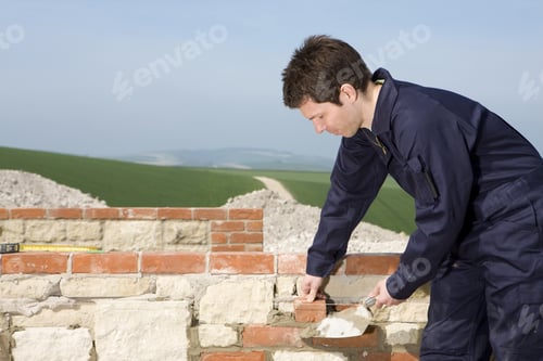 Preview: Man Bricklaying Wall With Trowel