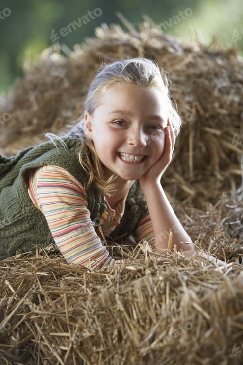 Preview: Girl Lying On Hay, Smiling, Side View, Portrait