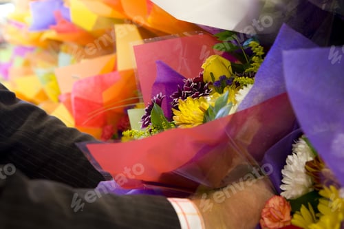 Preview: Man Choosing Bunch Of Fresh Flowers