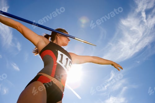 Preview: Female Athlete Preparing To Throw Javelin In Athletics Competition