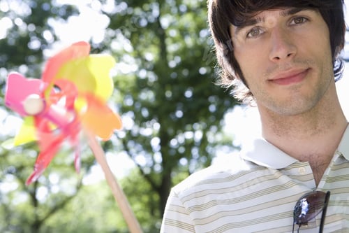 Preview: Young Man With Pinwheel, Smiling, Portrait (Blurred Motion)