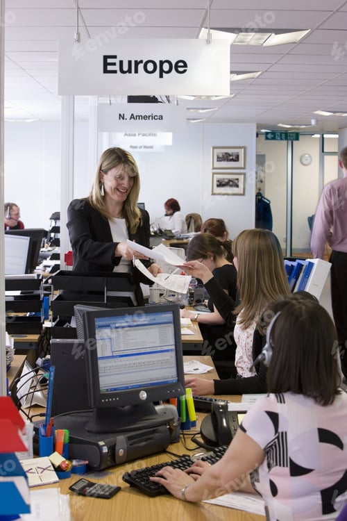 Preview: Sales People Working At Desks In Call Center Office