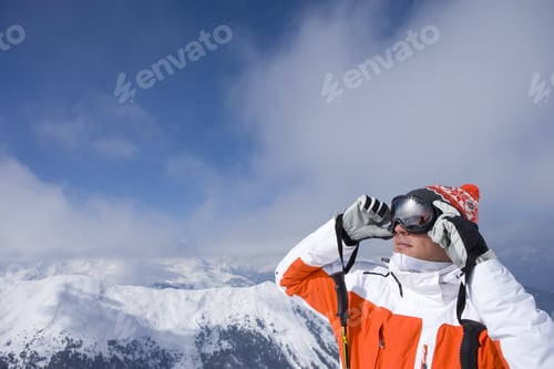 Preview: Skier On Mountain Top Adjusting Goggles