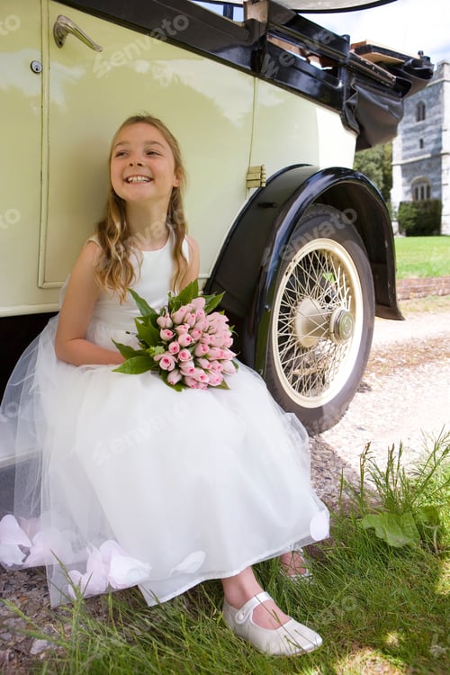 Preview: Flower Girl With Bouquet Of Flowers By Vintage Car On Wedding Day