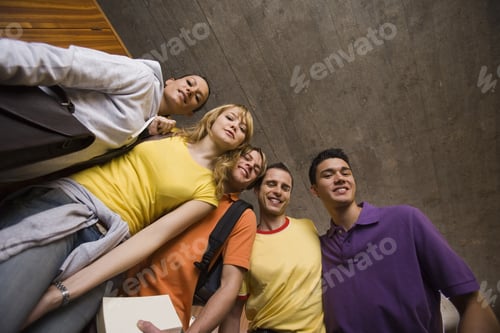 Preview: Low Angle View Of Three Young Men And Two Young Women Smiling