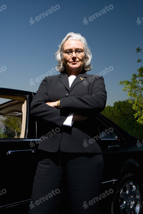 Preview: Businesswoman Posing Near Car