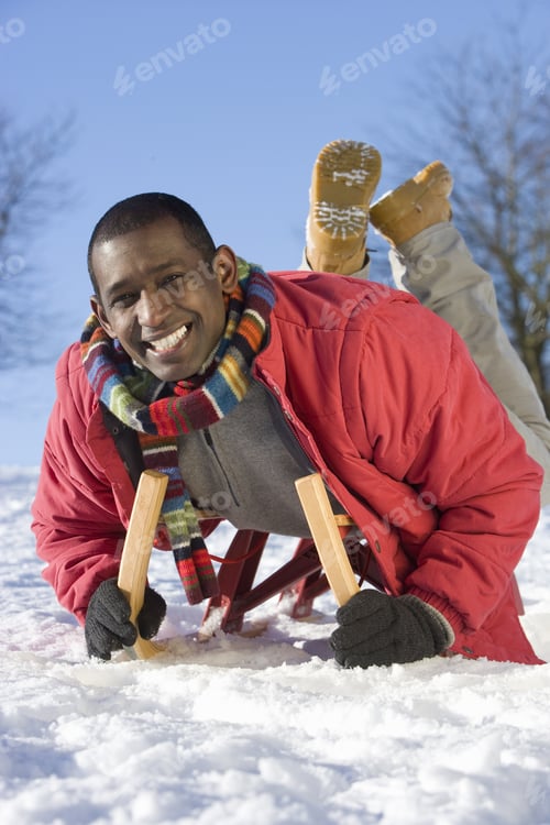 Preview: Excited Man Sledding Down Snowy Hill On Sled