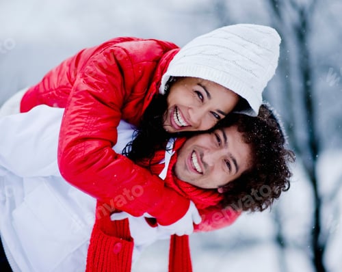 Preview: Man Giving Woman Piggyback On Snowy Winter Day Smiling At Camera