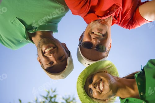Preview: Low Angle View Two Mid Adult Men And A Mid Adult Woman Smiling