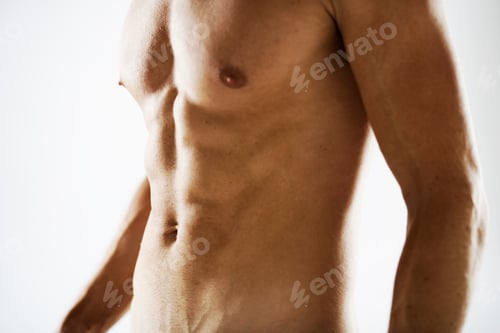 Preview: Studio Detail Of Male Nude Torso Against White