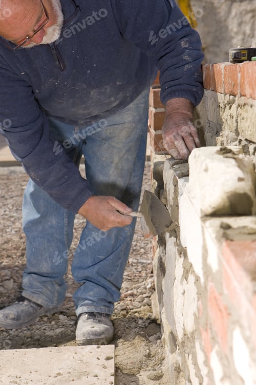 Preview: Man Bricklaying Wall With Trowel