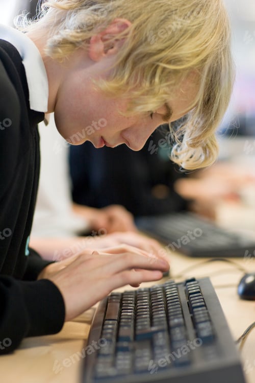 Preview: Male High School Student Using Keyboard In Computer Science Lesson