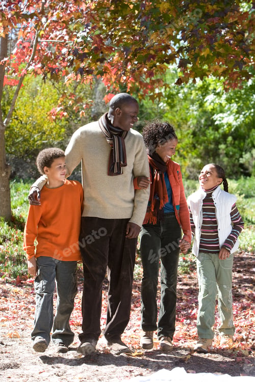 Preview: Family Walking Through Autumn Park Together