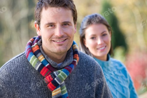 Preview: Couple On Outdoor Autumn Walk In Countryside Smiling At Camera