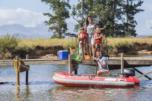 Preview: Family Getting Into Inflatable Boat For Fishing Trip
