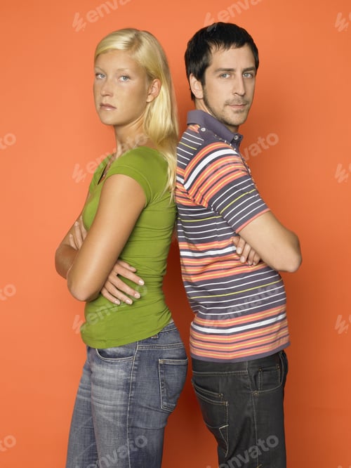 Preview: Young Couple Standing Back To Back