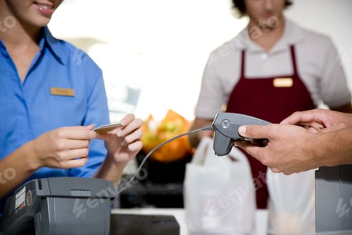 Preview: Close Up View Of A Customer Paying By Credit Card In A Supermarket