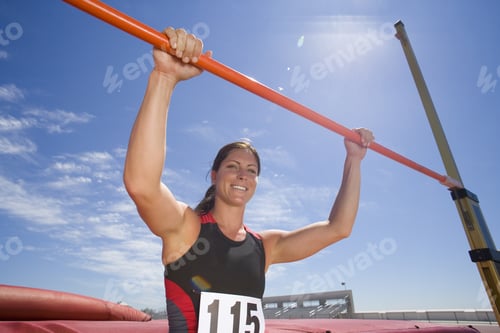Preview: Young Female Athlete With Hands On Bar, Low Angle View (Lens Flare)