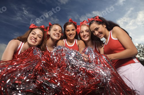 Preview: Portrait Of Five Cheerleaders Holding Pom-Poms And Smiling