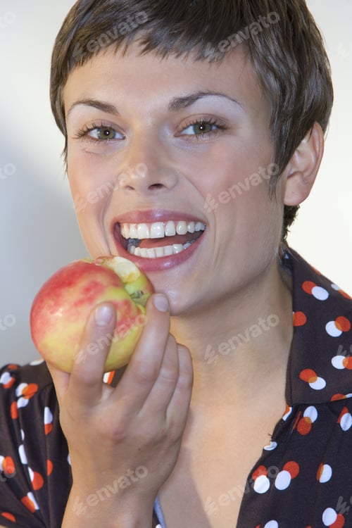 Preview: Woman Eating Apple, Smiling, Portrait