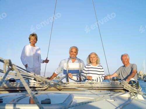 Preview: Group Of Senior Friends On Deck Of Sailing Boat In Marina At Camera