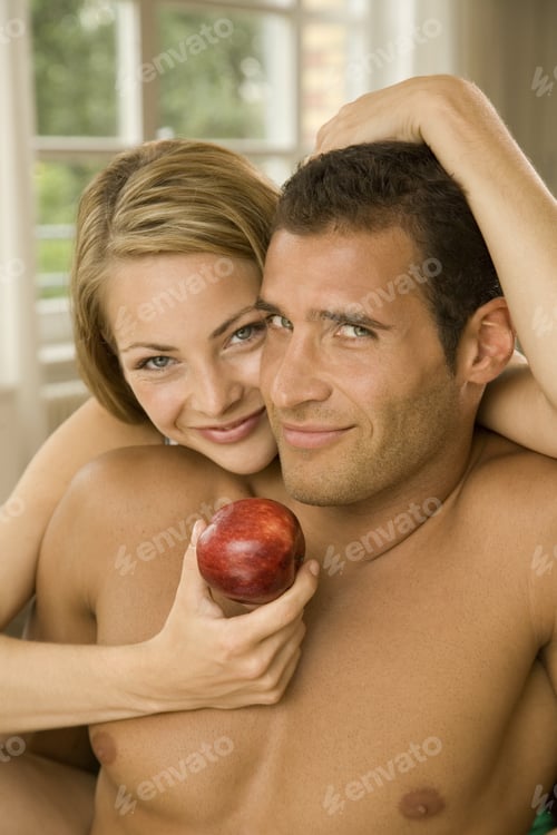 Preview: Portrait Of A Young Woman Embracing A Young Man From Behind And Smiling