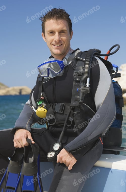 Preview: A Male Scuba Diver Sitting On A Boat