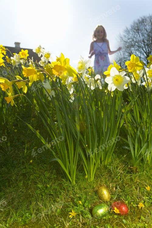 Preview: Girl Finding Chocolate Easter Eggs In Flowers