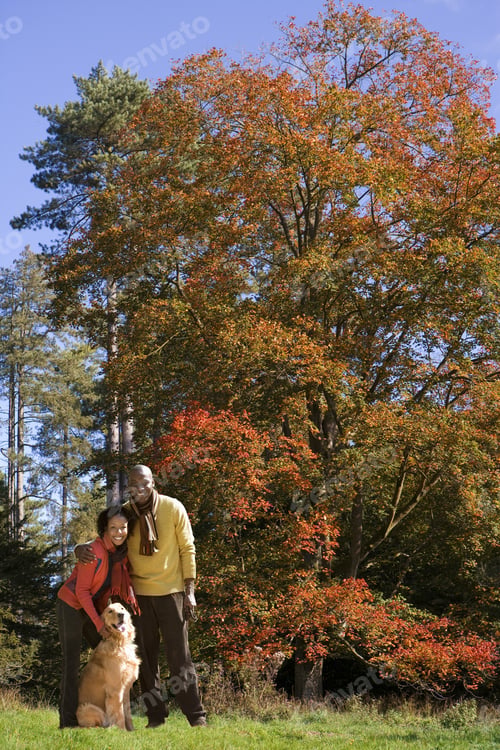 Preview: African Couple With Dog In Park In Autumn