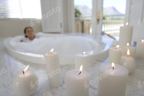 Preview: Woman Enjoying Relaxing Bath Surrounded by Candles