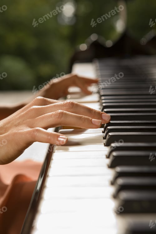 Preview: Close-Up Of A Person'S Hands Playing A Piano