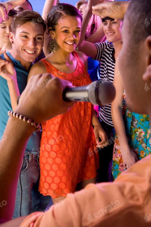 Preview: Young People Dancing To Dj With Microphone Performing In Nightclub