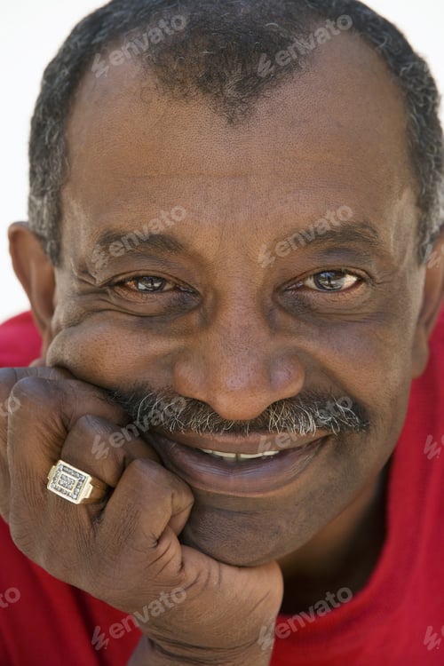 Preview: Senior Man With Moustache, Wearing Red T-Shirt And Ring, Hand On Chin, Smiling, Close-Up, Portrait