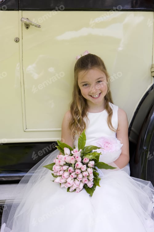 Preview: Flower Girl (10-12) With Bouquet Of Flowers Sitting By Vintage Car, Smiling, Portrait, Elevated View