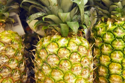 Preview: Selection Of Pineapples On Display On Market Stall, Close-Up (Full Frame)