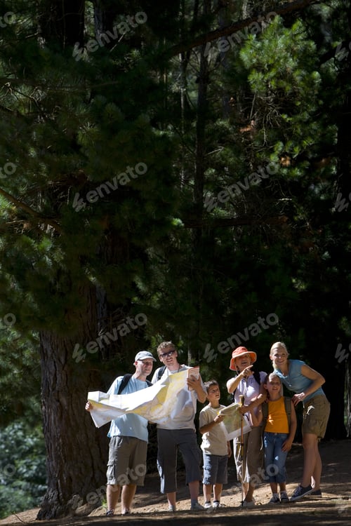 Preview: Family Standing In Woods Looking At Map