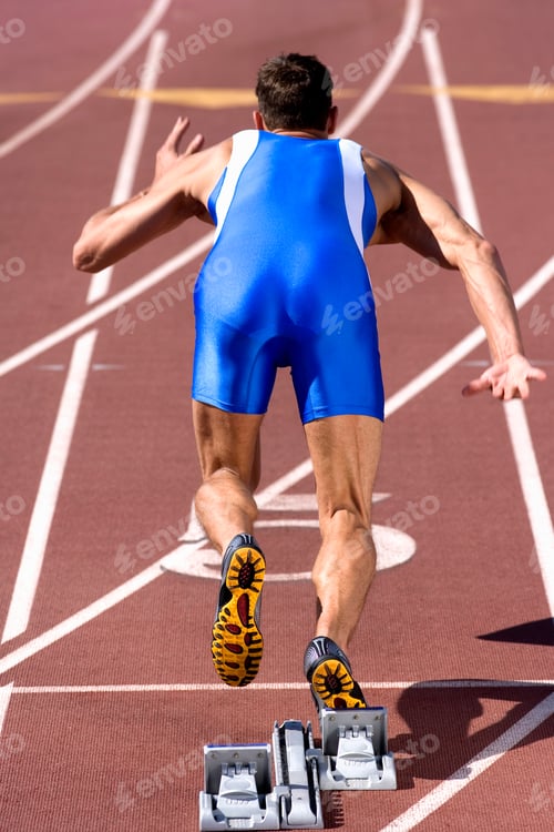 Preview: Competitive Male Athlete Leaves Starting Blocks In Sprint Running Race