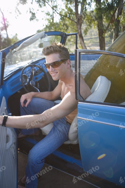 Preview: Bare Chested Man In Convertible Car, Smiling, Portrait