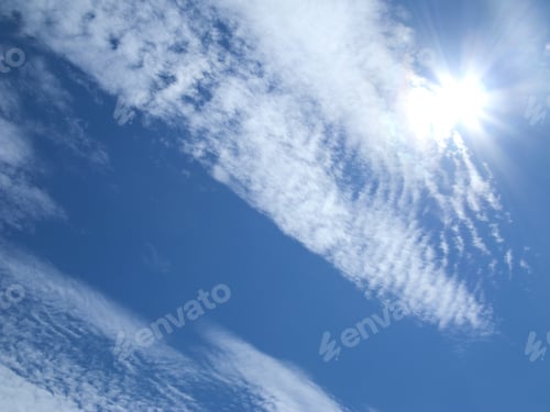 Preview: Sun And Clouds Floating In Blue Sky