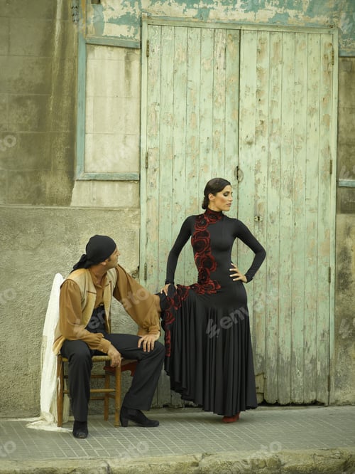 Preview: Young Man Sitting On A Chair With A Young Woman Beside Him