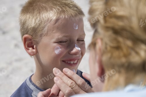 Preview: Grandmother Applying Sunscreen To Grandsonã¢Â?Â?S Face