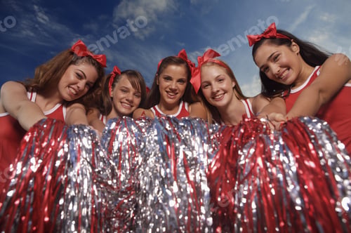 Preview: Portrait Of Five Cheerleaders Holding Pom-Poms And Smiling