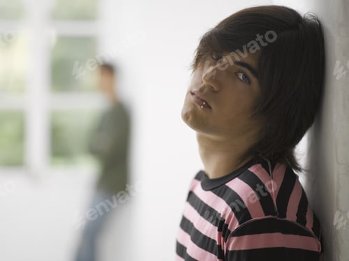Preview: Portrait Of A Young Man Leaning Against A Wall