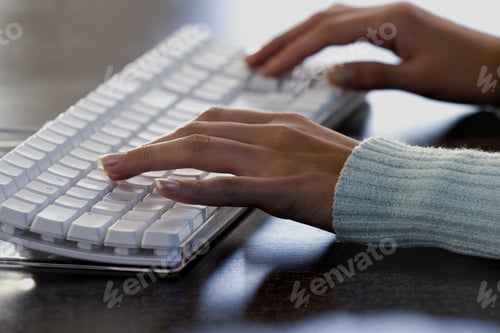 Preview: Close-Up Of A Woman'S Hands Typing On A Computer Keyboard
