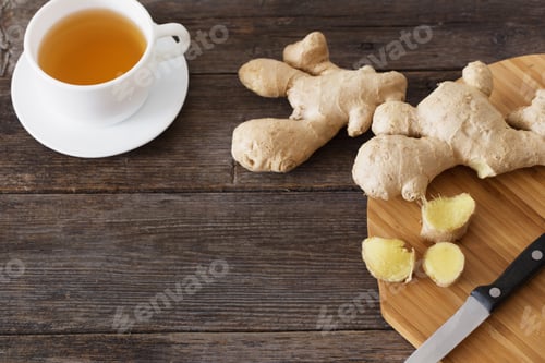 Preview: Ginger Tea In A White Cup On Wooden Background