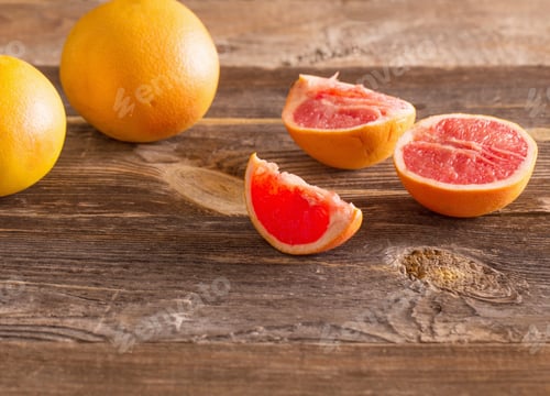 Preview: Set Of Sliced Citrus Fruits Over Wooden Background