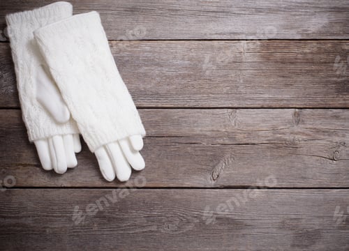 Preview: Mittens On Wooden Background