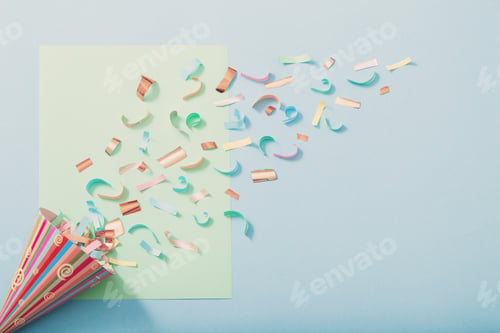 Preview: Birthday Hat With Confetti On Blue Paper Background